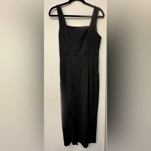 Luxedo black dress size medium brand new with tags, slit on right side